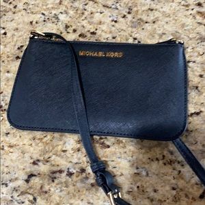 Michael Kors.  Small crossover bag